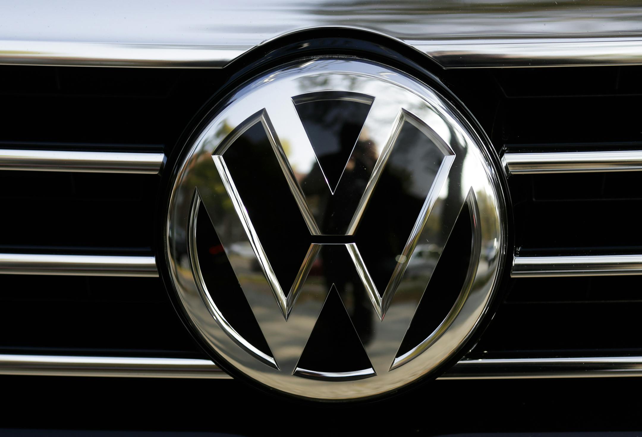 The VW sign of Germany's car company Volkswagen at the radiator grill of a VW car photographed in, Berlin, Germany, Monday, Oct. 5, 2015.
