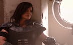 This image released by Disney Plus shows Gina Carano in a scene from "The Mandalorian." The ambitious eight episode show with the budget of a feature 