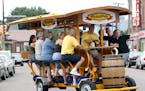 In this file photo, a Pedal Pub makes its way through downtown Minneapolis.