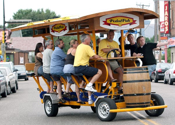 In this file photo, a Pedal Pub makes its way through downtown Minneapolis.