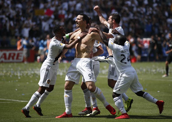 Los Angeles Galaxy's Zlatan Ibrahimovic, of Sweden, celebrates his goal during the second half of an MLS soccer match against the Los Angeles FC Satur