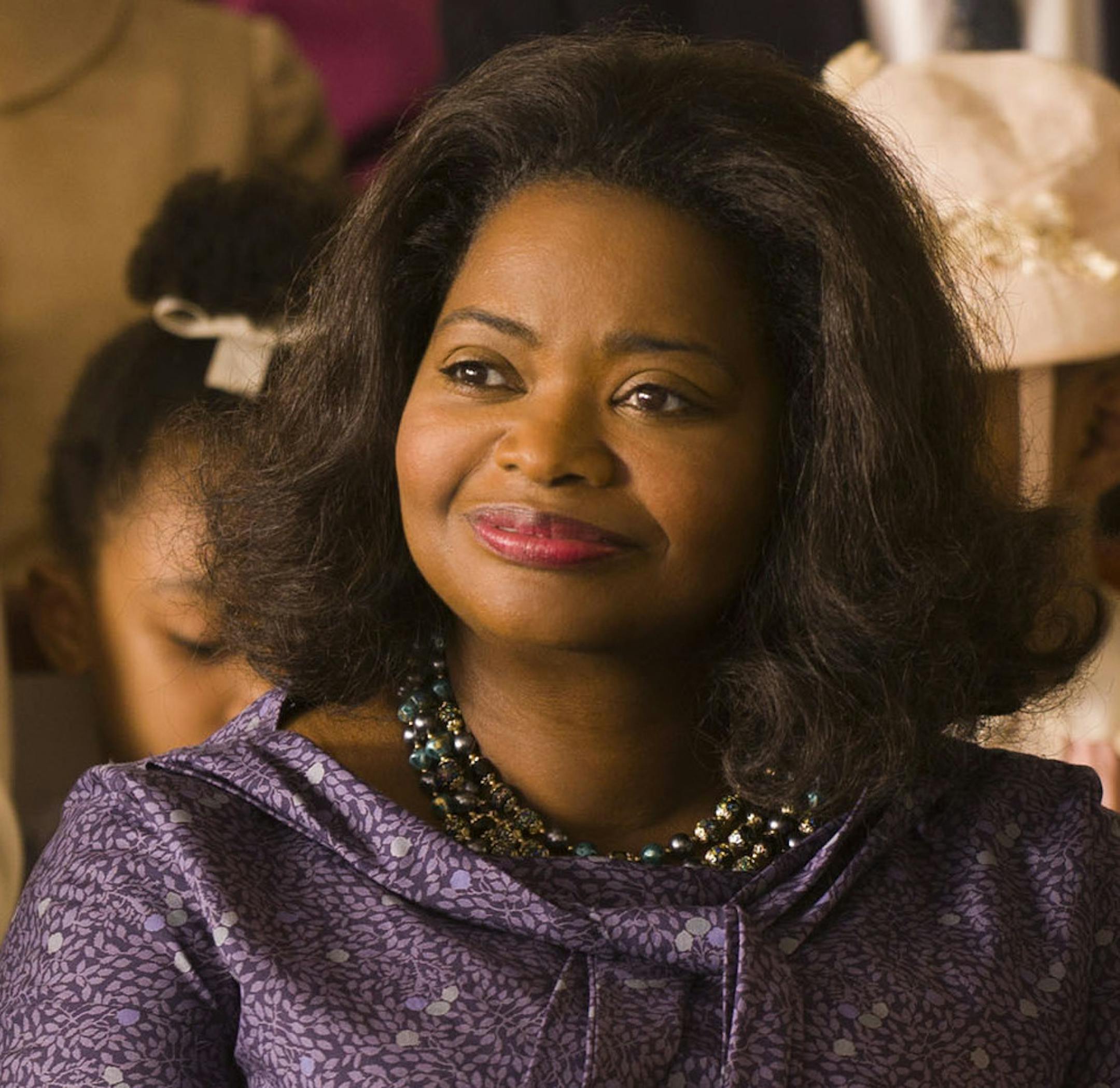 This image released by Twentieth Century Fox shows Taraji P. Henson, background left, Octavia Spencer, center, and Janelle Monae, background right, in a scene from "Hidden Figures." On Wednesday, Dec. 14, 2016, Spencer was nominated for a Screen Actors Guild award for outstanding performance by a female actor in a supporting role for her role in the film. (Hopper Stone/Twentieth Century Fox via AP)