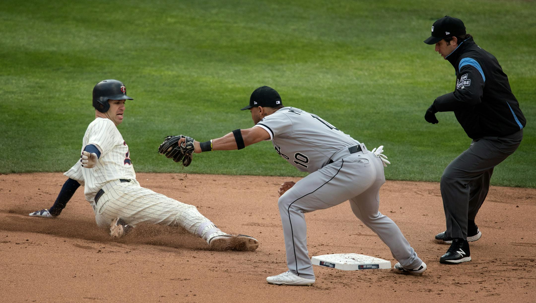 Joe Mauer slid into second base when he doubled in the seventh inning.