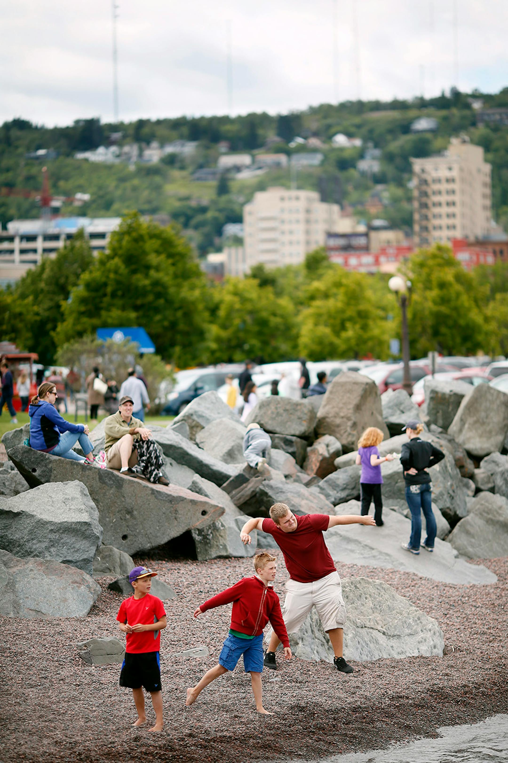 Tourists skipped rocks in Lake Superior Wednesday August 27 2015 in Duluth, MN. A profile on the resurgence of Duluth.