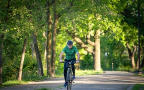 Ryan Cos. CEO Brian Murray takes a morning bike ride around Lake Harriet near his home in Minneapolis on May 23.
