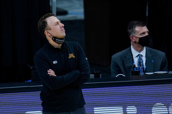 Minnesota head coach Richard Pitino on the bench in the second half of an NCAA college basketball game against Ohio State at the Big Ten Conference to