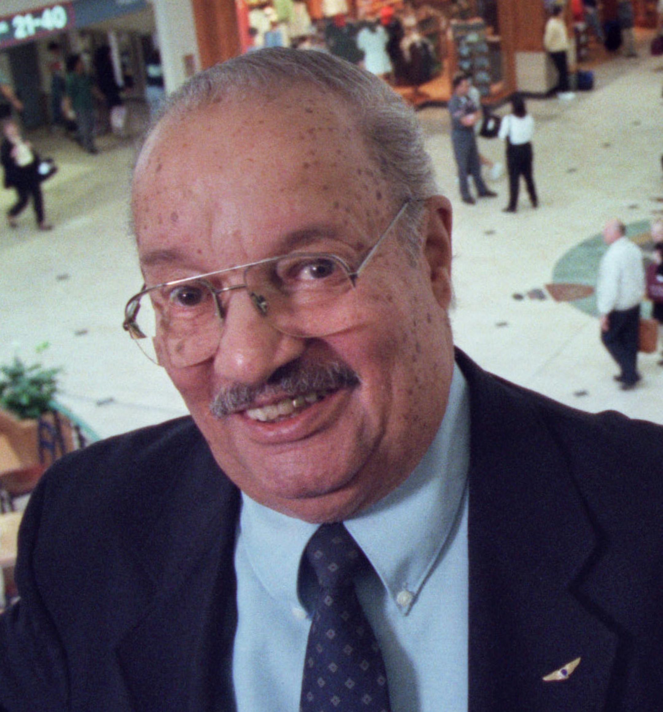 Chuch Nichols stood on the mezzanine level overlooking the main terminal at the Minneapolis-St. Paul Airport. Chuck Nichols, newly appointed MAC chairman, has survived everything from a propeller gash in the forehead to a landing with stuck landing gear to a kidney transplant. At 74, he was picked by Gov. Ventura to head the MAC during the period of some of its greatest growth. His interest in aviation started as a boy in Duluth with model airplanes. ORG XMIT: MIN2013110217271560