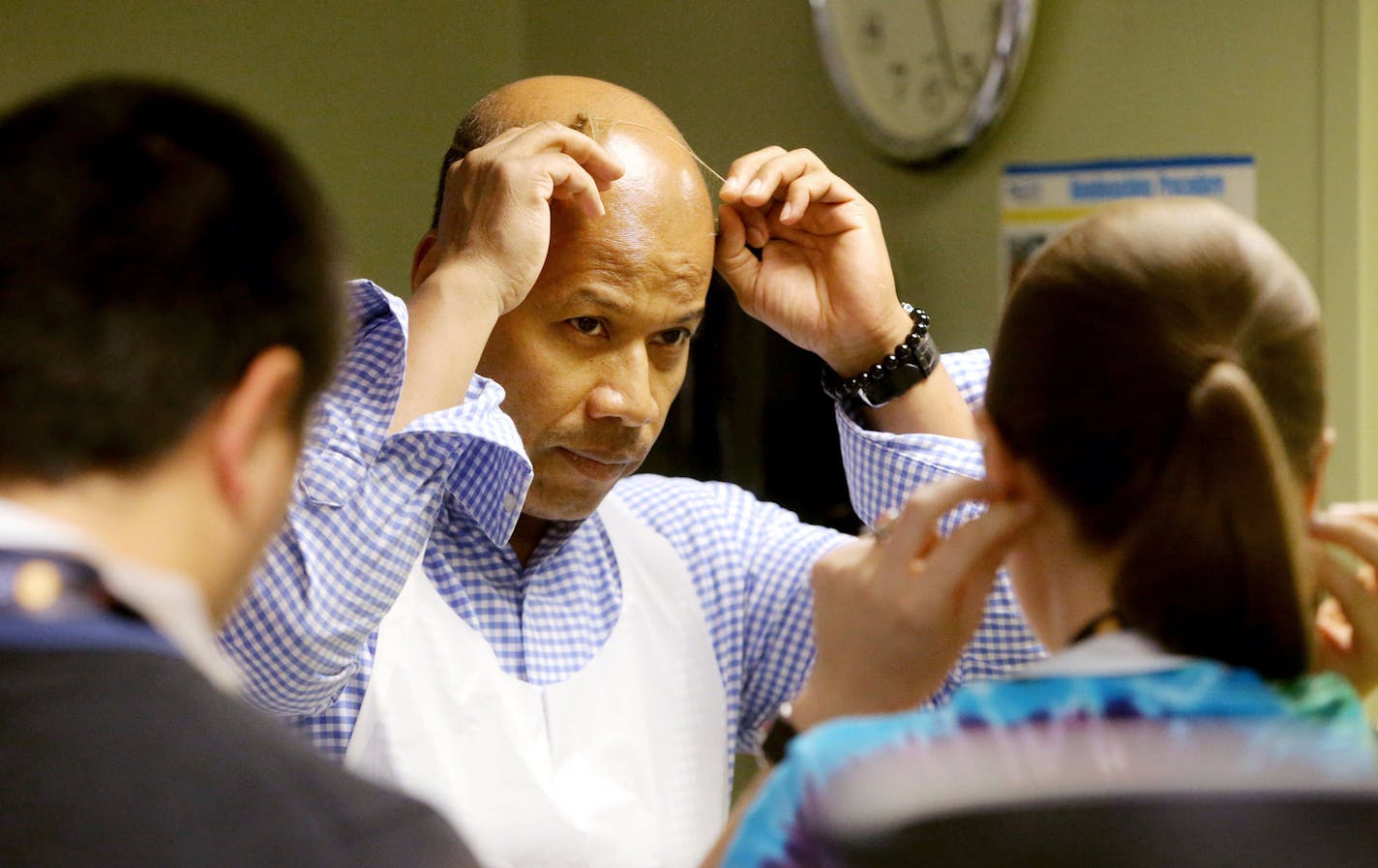 Minneapolis interim superintendent Michael Goar, along with some staff members, volunteered as a server at People Serving People Wednesday, June 17, in Minneapolis, MN. Here, Goar put on a hair net in preparation for serving guests. ](DAVID JOLES/STARTRIBUNE)djoles@startribune.com Minneapolis interim superintendent Michael Goar is not waiting patiently to see if he will be the next permanent leader of the state's third largest school district. Instead he is enacting controversial and sweeping ch