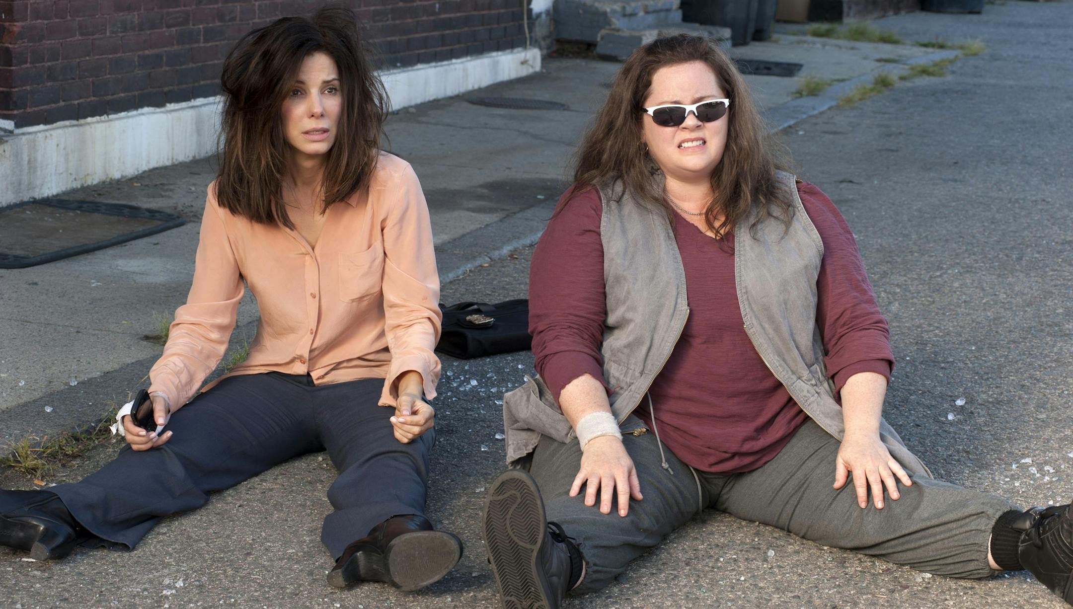 This film publicity image released by 20th Century Fox shows Sandra Bullock as FBI Special Agent Sarah Ashburn, left, and Melissa McCarthy as Boston Detective Shannon Mullins in a scene from "The Heat." (AP Photo/20th Century Fox, Gemma La Mana)
