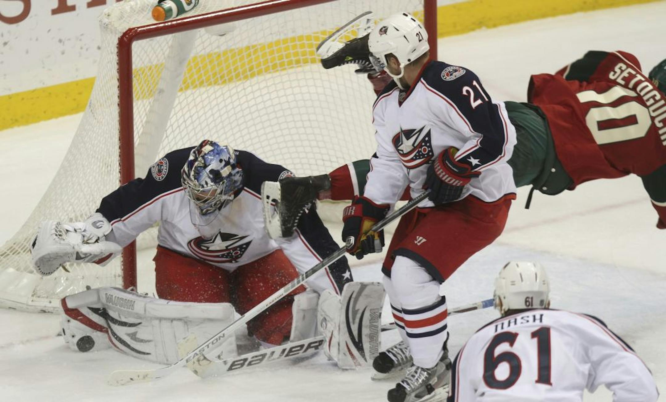 Blue Jacket goalie Steve Mason made a save a Wild's Devin Setoguchi flew across the front of the net during the third period at the Xcel Energy Center in St. Paul Min., Saturday, February 11, 2012. Blue Jackets won 3-1.