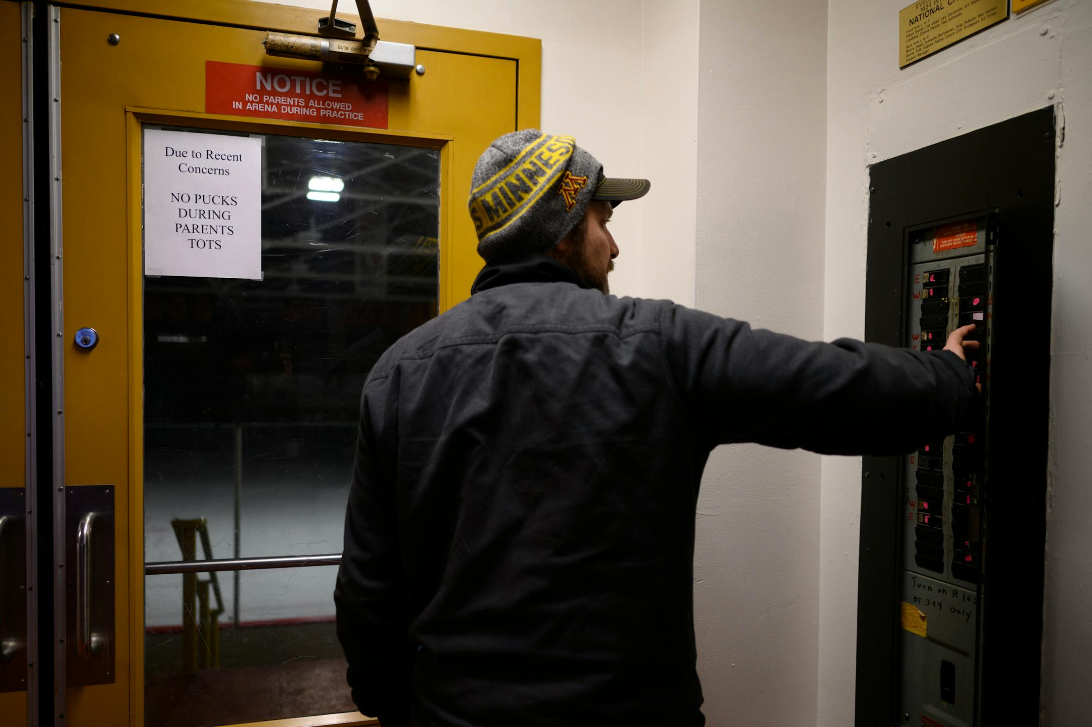 Jeff Torrel, a 96' graduate of Eveleth-Gilbert, shuts off the lights in the Eveleth Hippodrome, the former home rink for the Eveleth-Gilbert Golden Bears, Monday, Feb. 21, 2022. Torrel is the former Eveleth-Gilbert hockey head coach and the school's final hockey coach before they became part of the new Rock Ridge district. The plan is for the Hippodrome to still be used for some Rock Ridge games, but the Iron Trail Motors Event center in Virginia will be the team's home.  ] AARON LAVINSKY • aaron.lavinsky@startribune.com