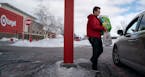 Tristan Conway brought an order from the Apple Valley Target store to the new drive up outside the store. (Glen Stubbe/Minneapolis Star Tribune/TNS) O