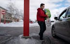 Tristan Conway brought an order from the Apple Valley Target store to the new drive up outside the store. (Glen Stubbe/Minneapolis Star Tribune/TNS) O