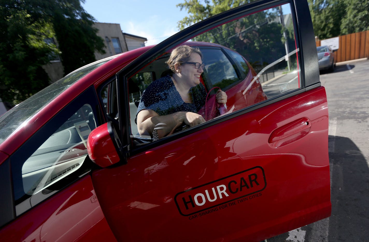 Lesley Goodman, of St. Paul, returned an Hourcar near Macalester College after running errands. It&#x2019;s one of the many car-sharing services growing locally.