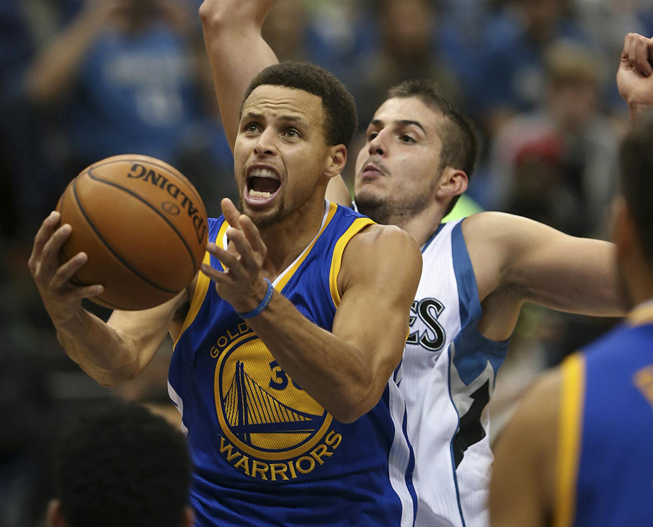 Golden State Warriors guard Stephen Curry (30) put up a second quarter shot past the defense of Timberwolves forward Nemanja Bjelica (88) Thursday night. Curry had 25 points at the half. ] JEFF WHEELER &#xd4; jeff.wheeler@startribune.com The Minnesota Timberwolves faced the Golden State Warriors in an NBA basketball game Thursday night, November 12, 2015 at Target Center in Minneapolis. ORG XMIT: MIN1511122030500228
