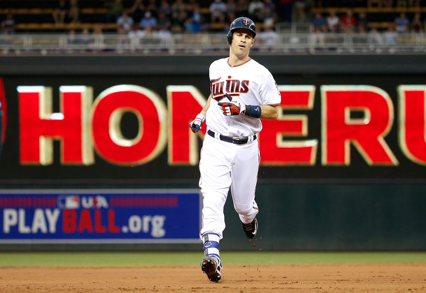 Minnesota Twins' Joe Mauer rounds the bases on his solo home run off Kansas City Royals starting pitcher Ian Kennedy during the first inning of a baseball game in Minneapolis, Monday, May 23, 2016.