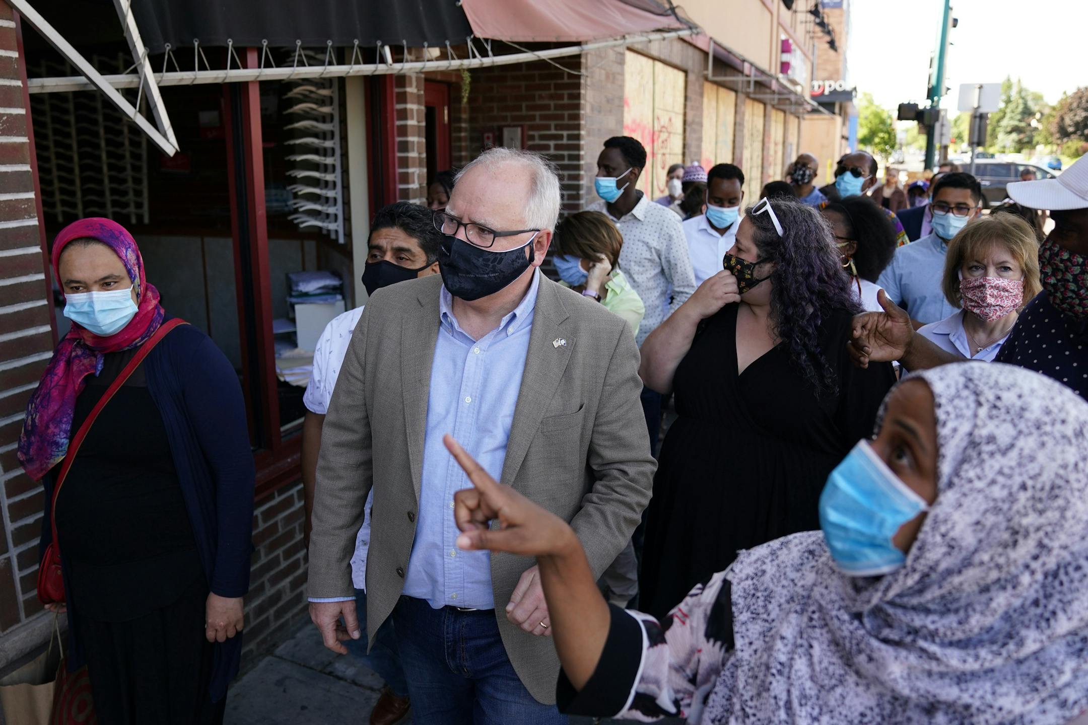 Gov. Tim Walz, Sen. Amy Klobuchar, and Sen. Tina Smith met with business owners that were affected by the looting and riots following the George Floyd protests Friday morning near Midtown Global Market on East Lake Street. ] ANTHONY SOUFFLE • anthony.souffle@startribune.com Gov. Tim Walz went for a haircut at Capitol Barbers then toured some of the sites where looting and vandalism occurred during the George Floyd protests and riots Friday, June 5, 2020 in Minneapolis.