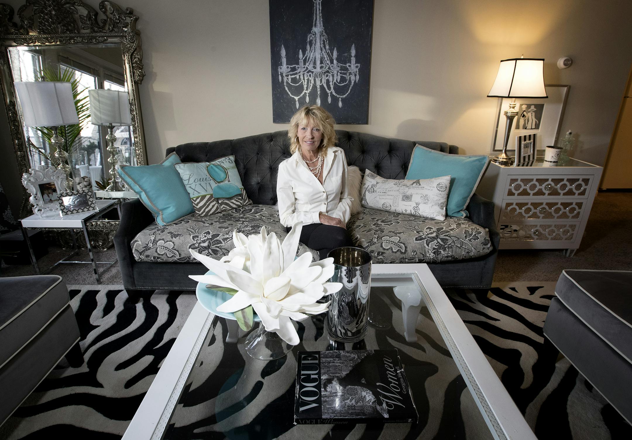 Designer Sue Hunter in the living room of her Minnetonka apartment. &#x201c;Surround yourself with everything you love, so it doesn&#x2019;t feel like an apartment,&#x201d; she said.