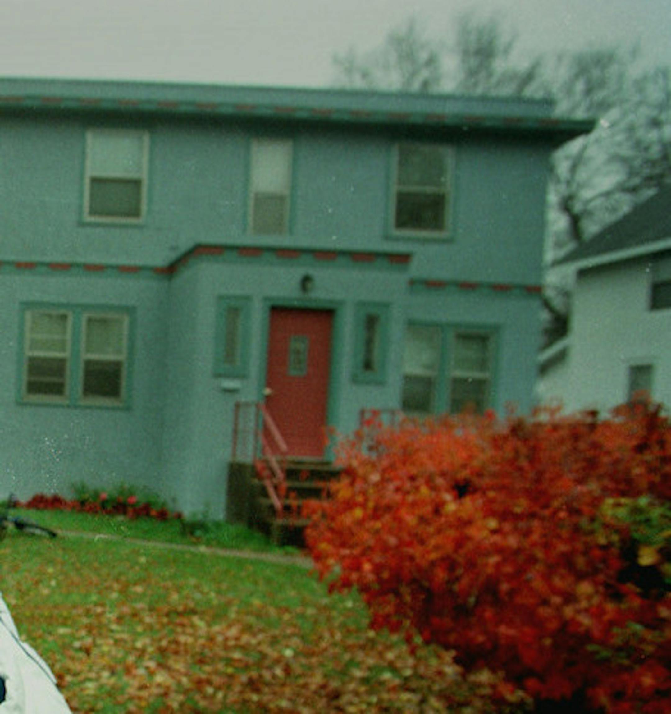 Dylan fan Mike Egan, who plans to give Bob Dylan a remake of a 1959 letter jacket with Bobís name and a music letter on the sleve, stands outside Dylans boyhood home in Hibbing with a copy of Dylanís New Morning album. (See other pic for Egans face.)