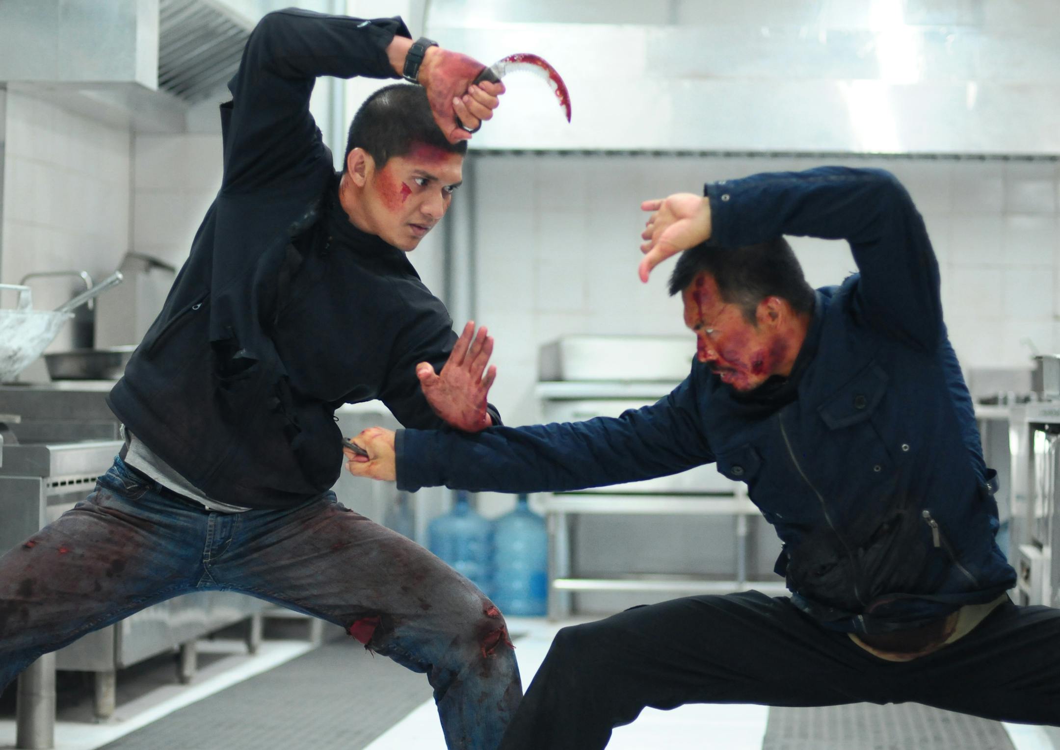 This image released by Sony Pictures Classics shows Iko Uwais, left, and Cecep Arif Rahman in a scene from "The Raid 2." (AP Photo/Sony Pictures Classics)