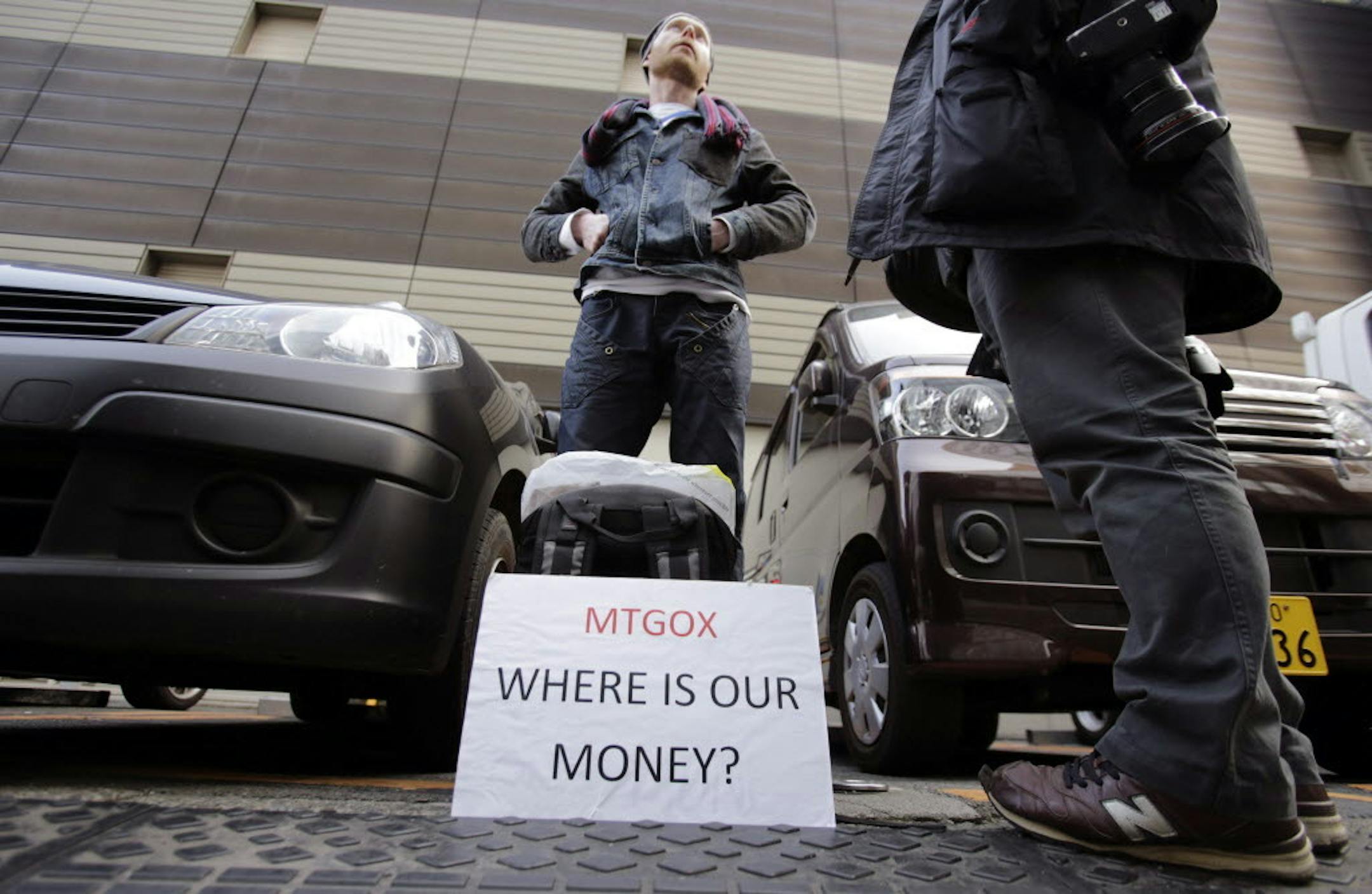 Feb. 26, 2014: Bitcoin trader Kolin Burges stands in protest outside an office building housing Mt. Gox in Tokyo. The Mt. Gox bitcoin exchange in Tokyo filed for bankruptcy protection, acknowledging that a significant amount of the virtual currency had gone missing.