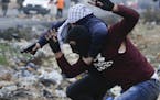 Undercover Israeli police arrest a Palestinian demonstrator during clashes following protests against U.S. President Donald Trump's decision to recogn