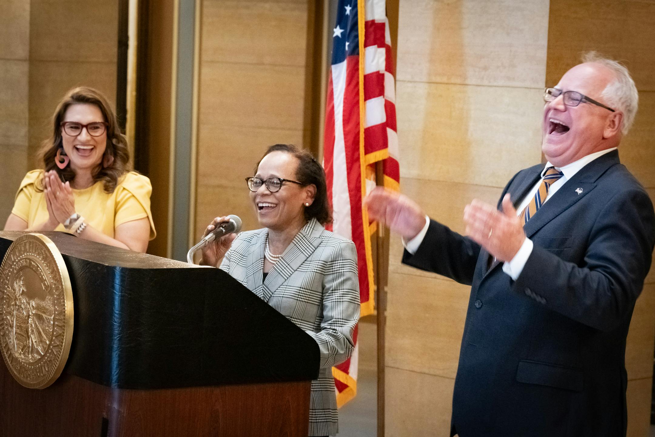 Gov. Tim Walz and Lt. Gov. Peggy Flanagan laughed as Natalie Hudson responded to a question about her age as she will be become chief justice of the Minnesota Supreme Court.
