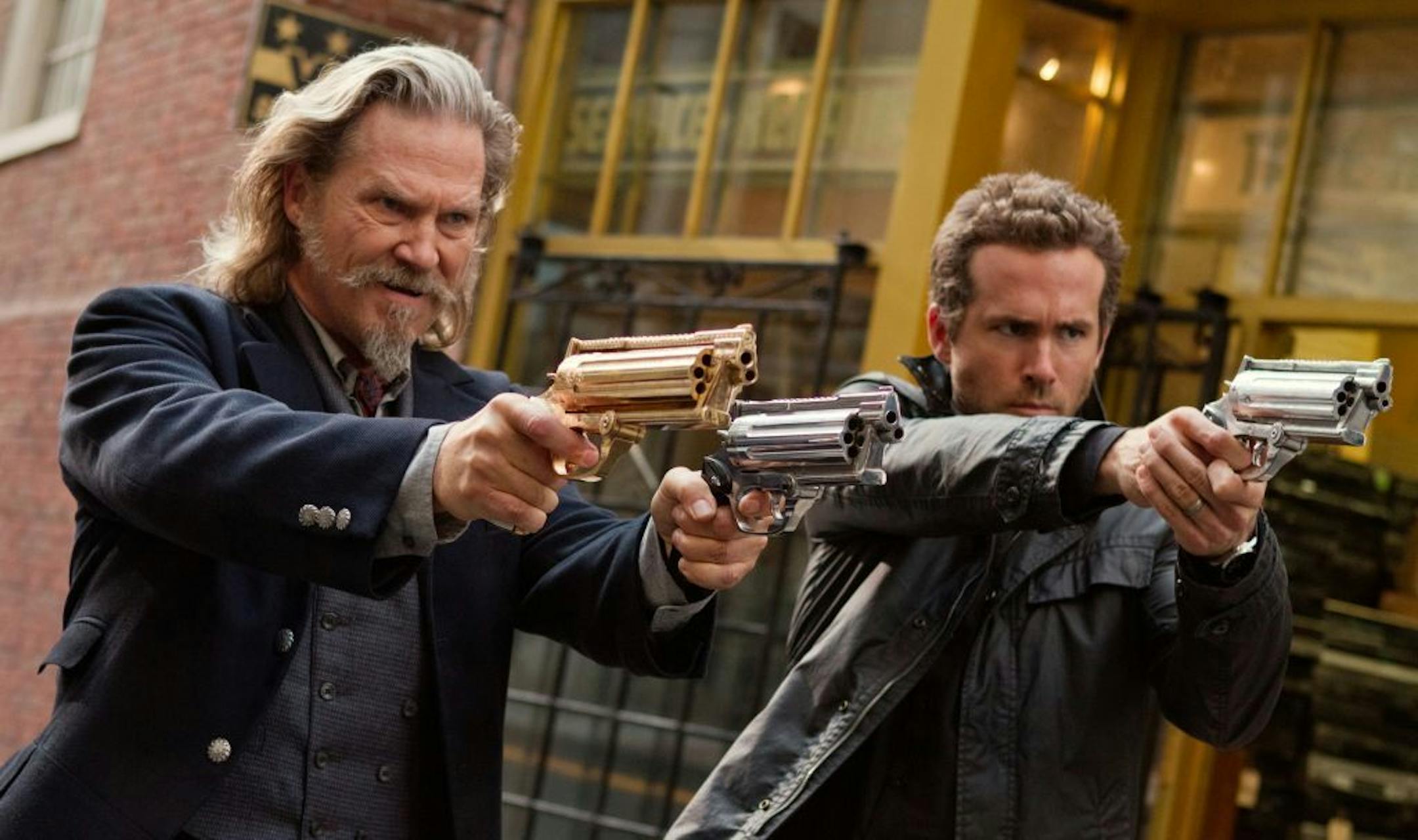 This film publicity image released by Universal Pictures shows Jeff Bridges, left, and Ryan Reynolds in a scene from "R.I.P.D." The film will be released nationwide on Friday, July 19.