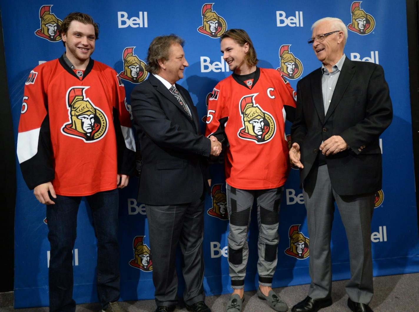 Bobby Ryan, left, Eugene Melnyk, second from left, owner of the Ottawa Senators Hockey Club, Erik Karlsson, second from right, and Senators general manager Bryan Murray, right, appear at a news conference Thursday, Oct. 2, 2014 in Ottawa. Karlsson was named captain of the Senators and Ryan was signed to a seven-year, $50.75-million contract extension.(AP Photo/The Canadian Press, Sean Kilpatrick)