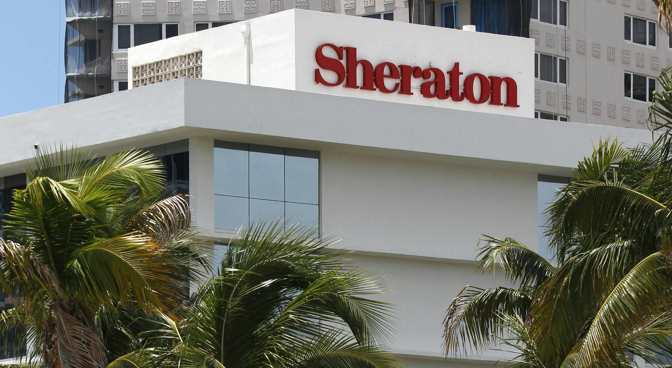 FILE - This July 25, 2011, file photo, shows the Sheraton Fort Lauderdale Beach Hotel, a member of the Starwood Hotels and Resorts group, in Fort Lauderdale, Fla. A fight for control of the Starwood hotel chain is under way after a buyout offer from a consortium led by China’s Anbang Insurance Group. Starwood Hotels & Resorts Worldwide Inc. said Monday, March 14, 2016, that it still favors the bid from Marriott, but that it’s looking at the latest bid. (AP Photo/Wilfredo Lee, File)