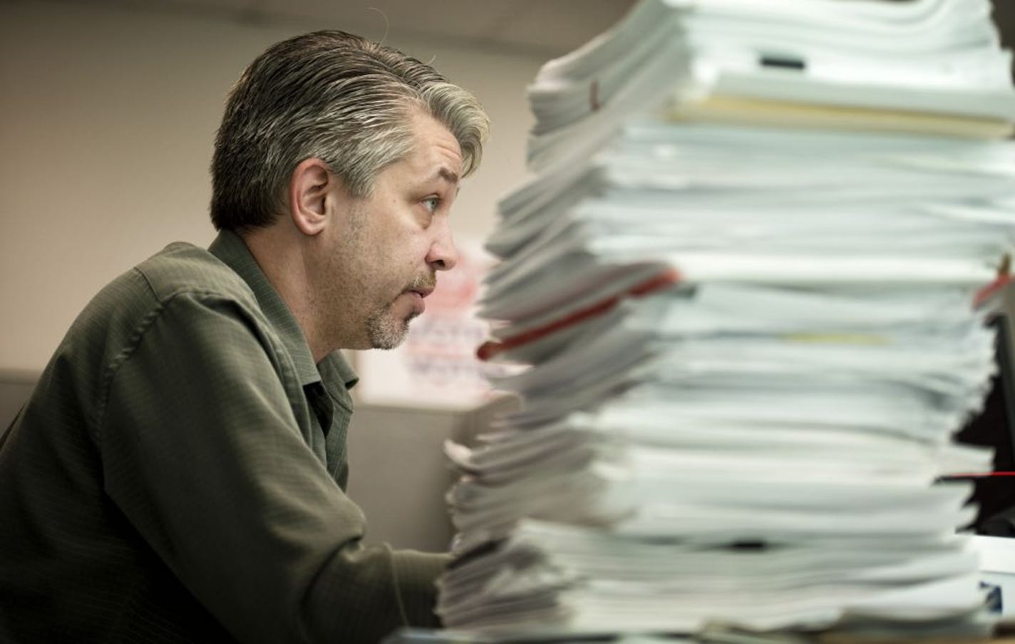 Dan McGrath, director of Minnesota Majority, with a stack of documents he says are 1099 instances where convicted felons were wrongly allowed to vote in the 2008 election. He has been examining data to find examples of voter fraud in Minnesota. Monday, October 22, 2012