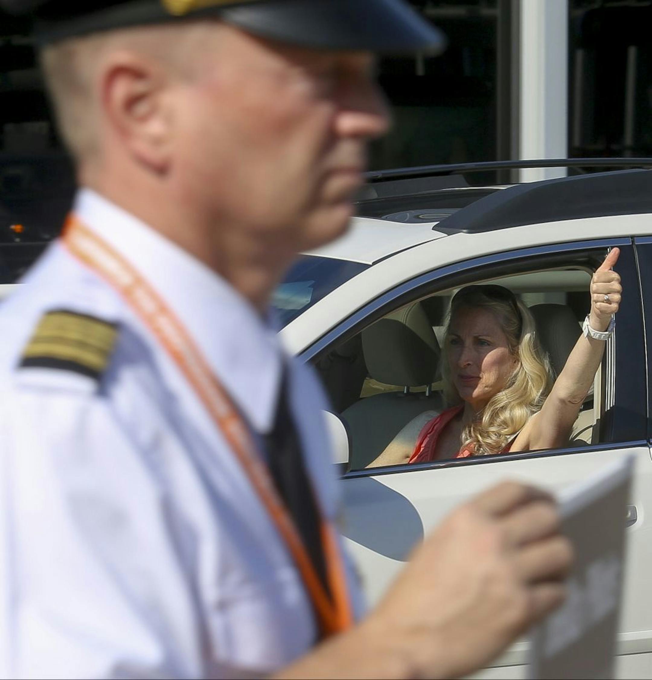 Passers by such as this woman honked their car horns, cheer and gave picketers a thumbs up as a sign of solidarity.