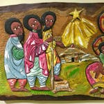 Mildred Turner of Omro, Wis., purchased this Ugandan Nativity scene, created on a wooden plaque, for her collection.