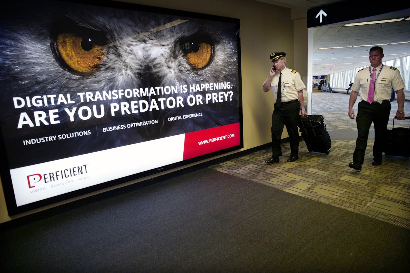 The carpet at MSP gets plenty of abuse especially in high traffic areas, portions will be replaced in time for the Super Bowl. Here, the black carpet will remain, the patterned carpet will likely be replaced. Richard Tsong-Taatarii/Richard.tsong-taatarii@startribune.com