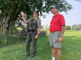 Conservation officer Felicia Znajda, left, met Osakis resident Lorry Stratioti on his property Aug. 18 over his concern about an injured osprey.