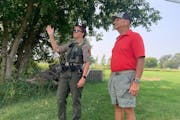 Conservation officer Felicia Znajda, left, met Osakis resident Lorry Stratioti on his property Aug. 18 over his concern about an injured osprey.