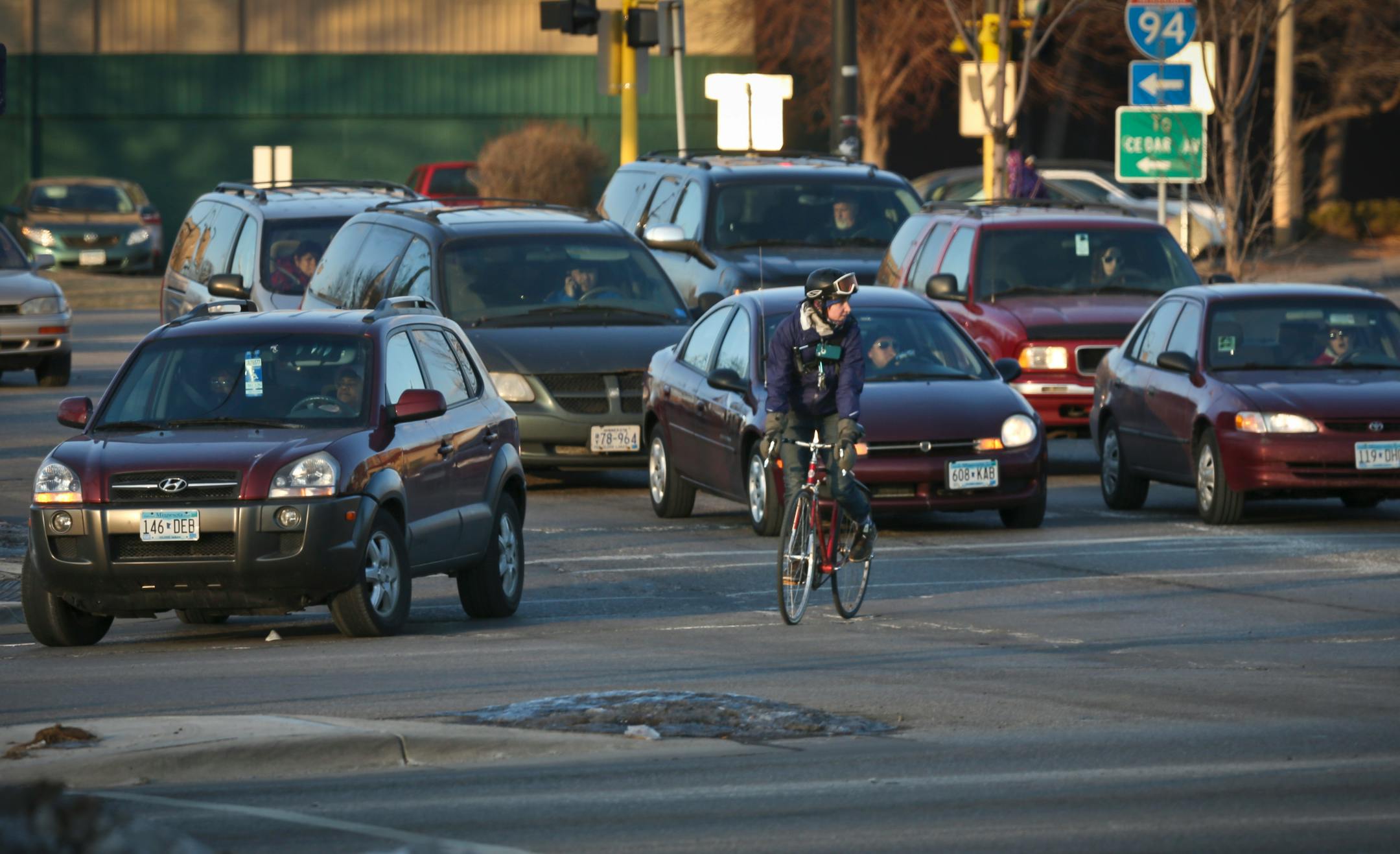 This 2013 file photo shows bicyclists and drivers at the intersection of Cedar Avenue and East Franklin Avenue in Minneapolis.