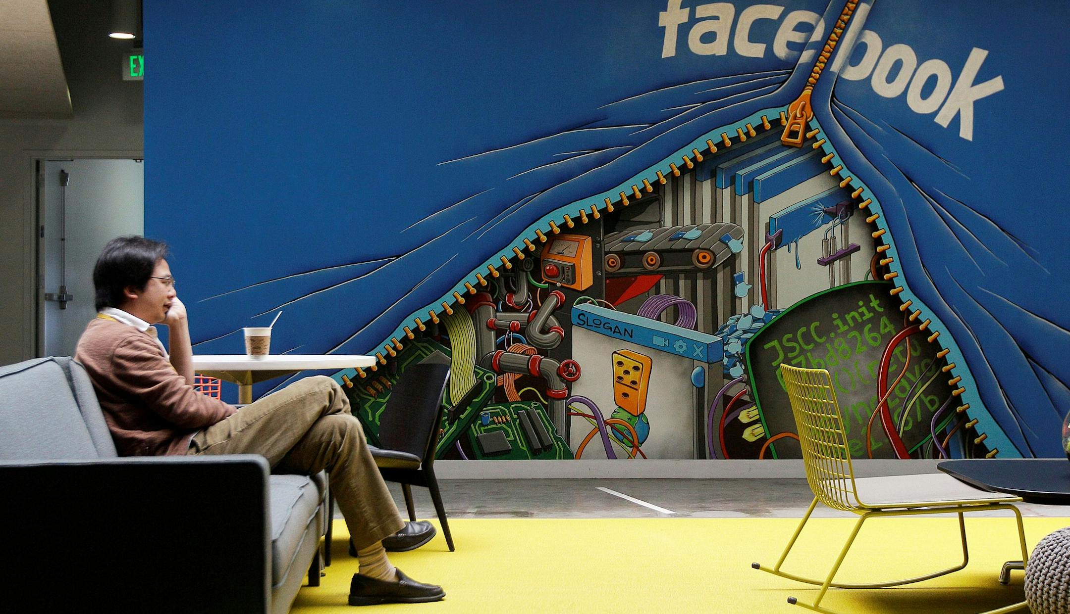 FILE-In this Friday, May 11, 2012, file photo, a worker sits in the Facebook office in Menlo Park, Calif. Silicon Valley, it turns out, doesn&#xed;t revolve around the stock prices of Facebook and its playful sidekick, Zynga. Instead, the optimism in Silicon Valley can be seen in a variety of ways in this area that covers roughly 40 miles from San Jose to San Francisco. (AP Photo/Jeff Chiu. File) ORG XMIT: NYBZ106