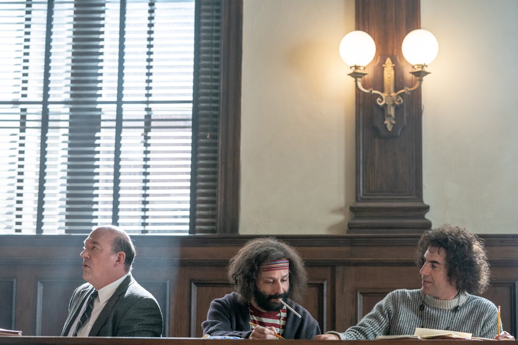 John Carroll Lynch, left, in 'The Trial of the Chicago 7' with Jeremy Strong and Sacha Baron Cohen.