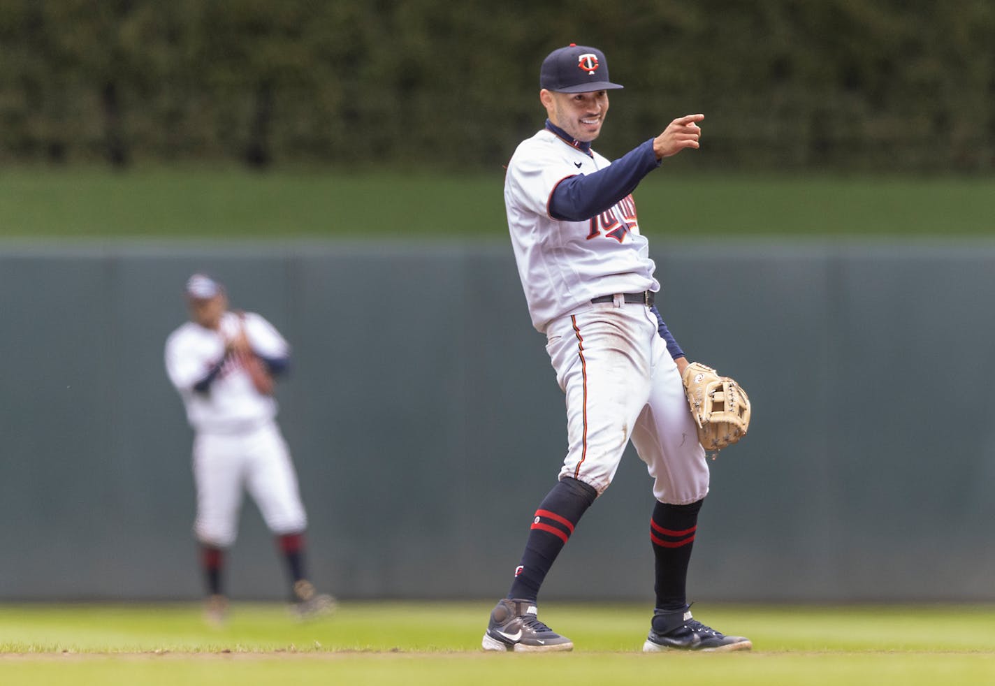 Twins shortstop Carlos Correa (4) celebrates after he threw the ball to Twins first baseman Luis Arraez (2) for an out during the top of the eighth inning at Target Field, in Minneapolis, Minn., on Thursday, April 28, 2022. ] Elizabeth Flores • liz.flores@startribune.com