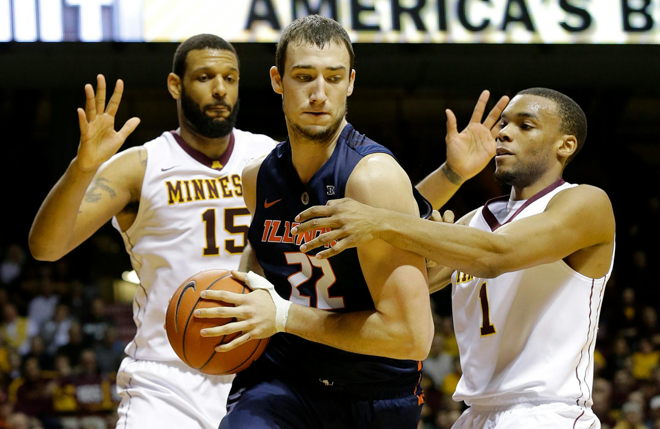 Gophers center Mo Walker (15) and guard Andre Hollins (1) were name all-Big Ten honorable mention Monday.