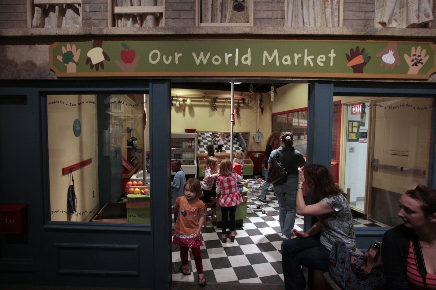 Children and adults as well, explored the grocery store exhibit at the Minnesota Children's Museum. ] JIM GEHRZâ€¢jgehrz@startribune.com (JIM GEHRZ/STAR TRIBUNE) / March 21, 2012 / 10:30 AM , St. Paul, MN**Background Info: Exhibits at the Minnesota Children's Museum are extremely popular with young visitors. Many of the exhibits are built by the museum itself and include, an ant hill, toy warehouse, grocery store and water play area.