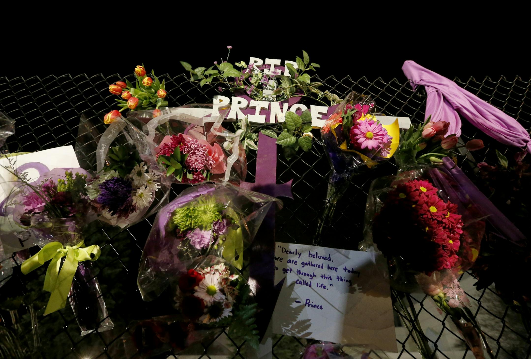 A memorial on a fence at Paisley Park Studios in Chanhassen, MN. Musician Prince was found dead at the site on Thursday morning.