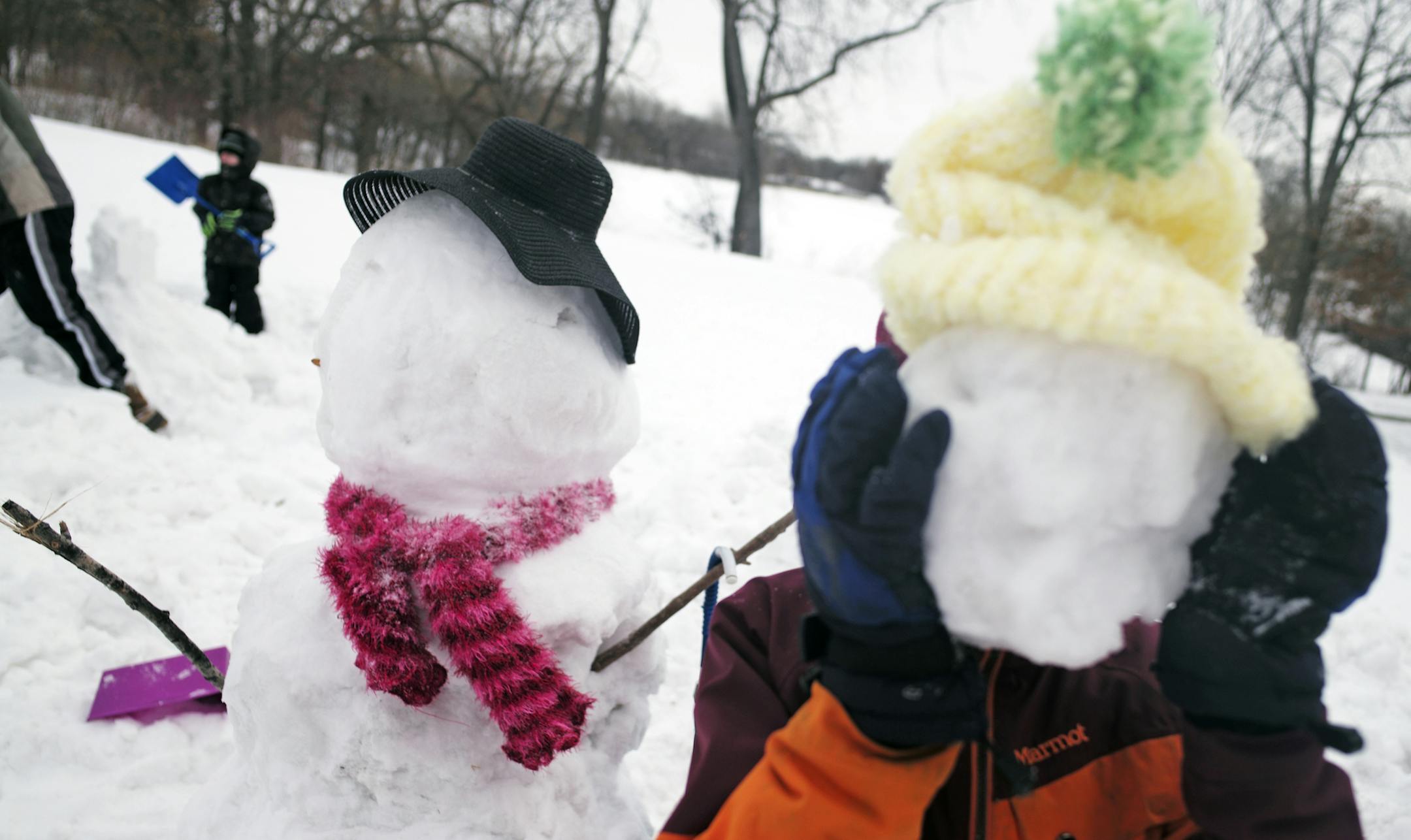 You can’t see Daniel Larkin, 10, of Golden Valley but he’s the kid holding up the head of a snowman. Daniel was one of the many ­children who didn’t have school on Monday, so they competed in the fourth annual Silverwood Park snowman-making contest in St. Anthony.