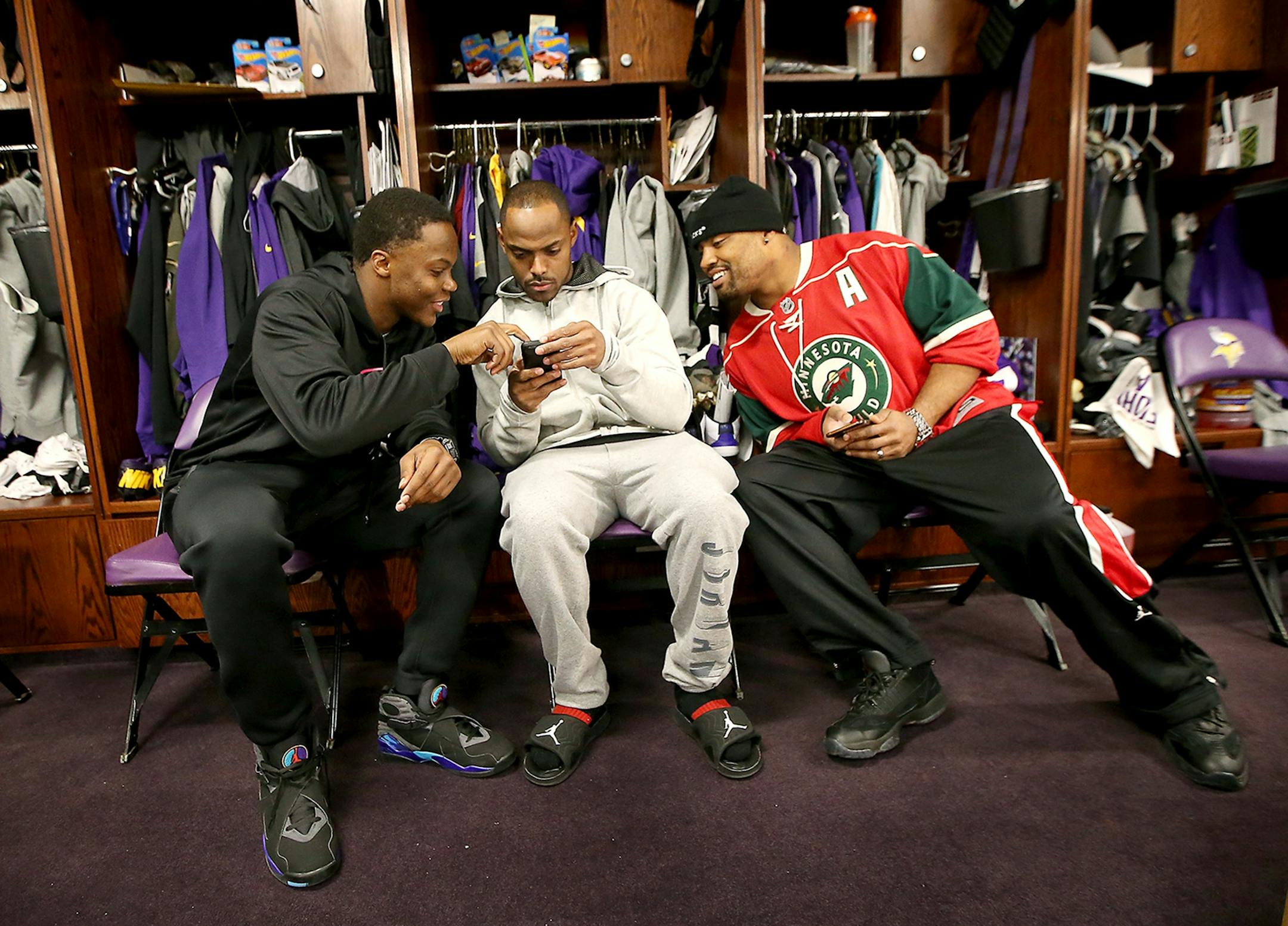 Minnesota Vikings Teddy Bridgewater, left Captain Munnerlyn, center, and Everson Griffen hung out in the locker room after being dismissed for the season at Winter Park, Monday, January 11, 2016 in Eden Prairie, MN.
