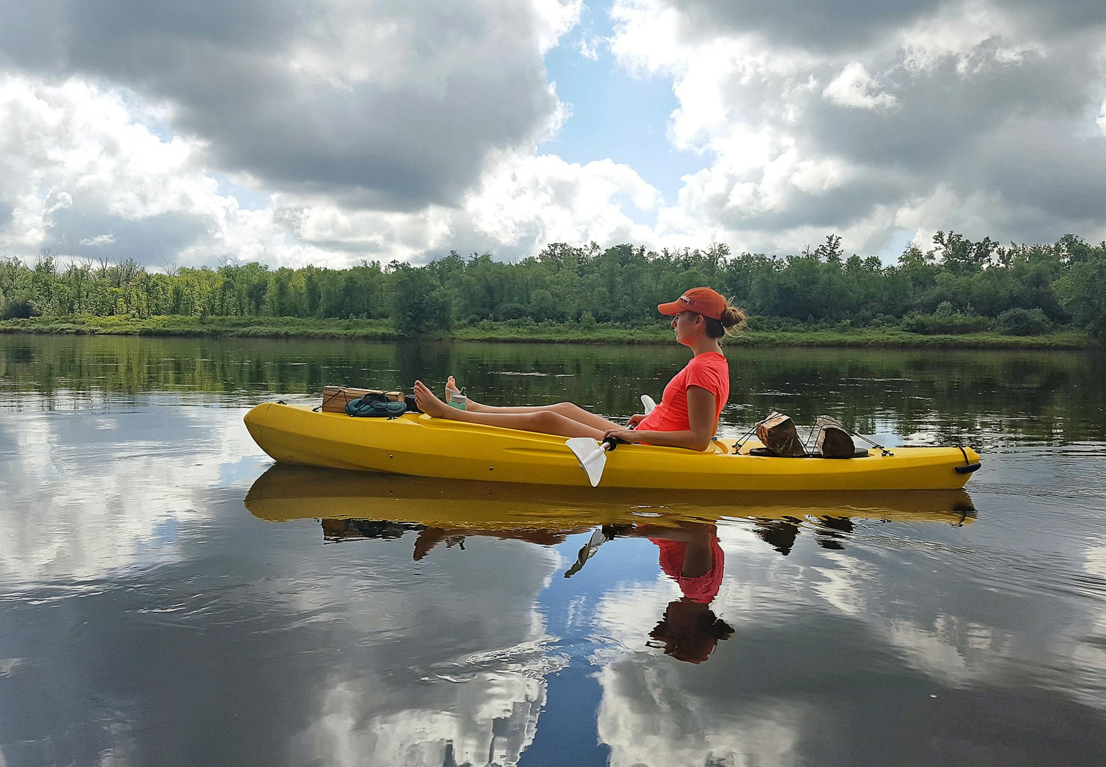 Courtney Lewis floated down the St. Croix River north of St. Croix Falls, Wis. The river current of about 3 mph made for easy paddling.