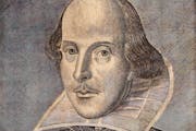 A vintage engraving depicts playwright William Shakespeare.