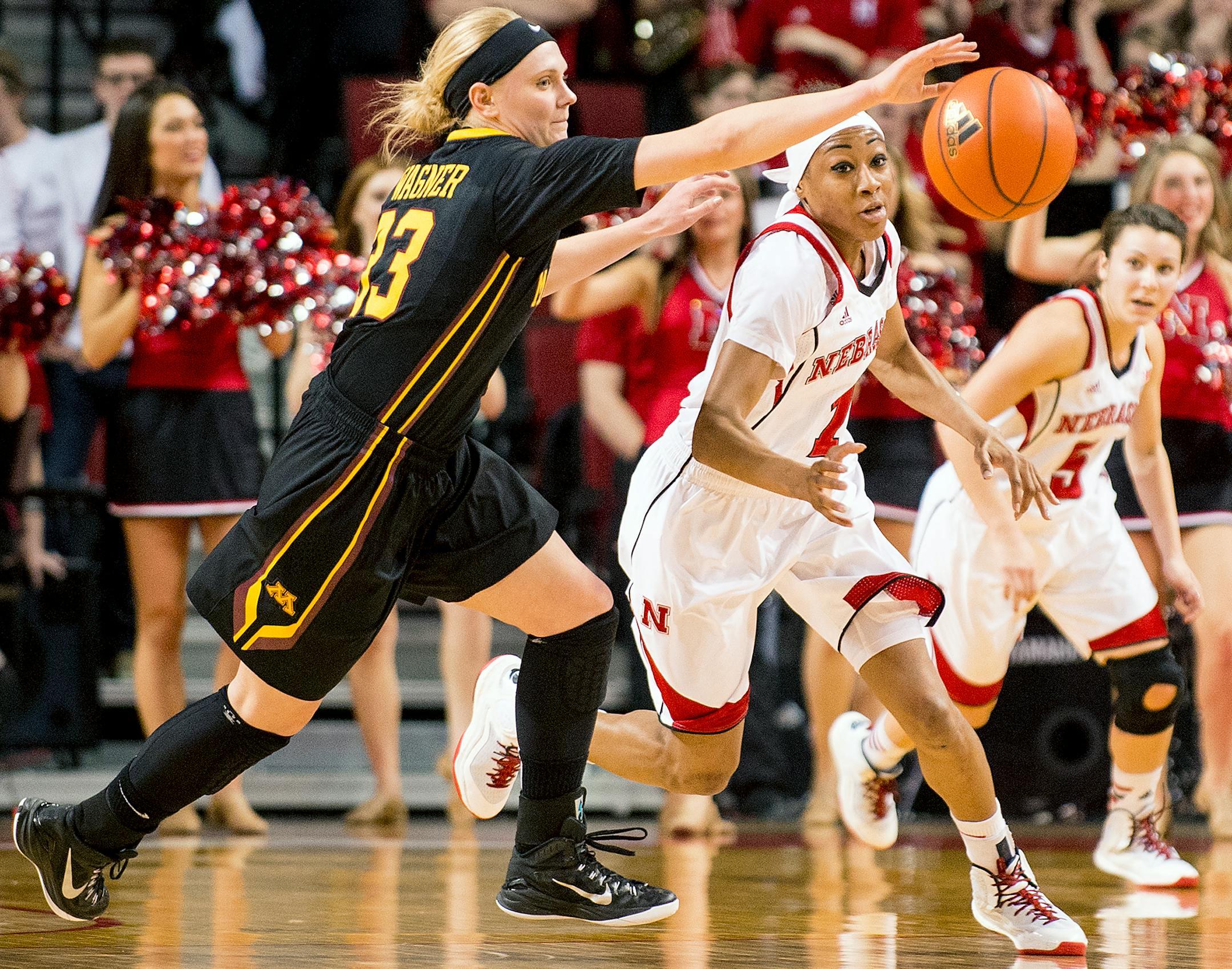 Nebraska guard Tear'a Laudermill (1) and Minnesota guard Carlie Wagner (33) vie for the loose ball in the second half of an NCAA basketball game on Tuesday, Feb. 24, 2015, in Lincoln, Neb. (AP Photo/The Journal-Star, Francis Gardler)