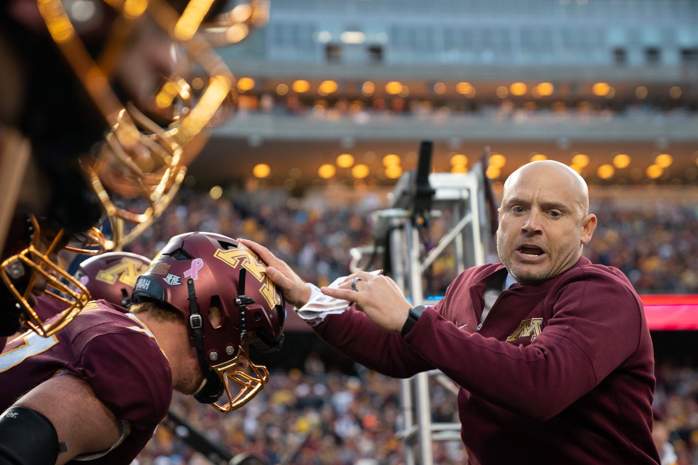 Minnesota head coach P.J. Fleck leads the team out of the tunnel before taking on Michigan Saturday, Oct. 07, 2023, at Huntington Bank Stadium in Minneapolis, Minn. ]