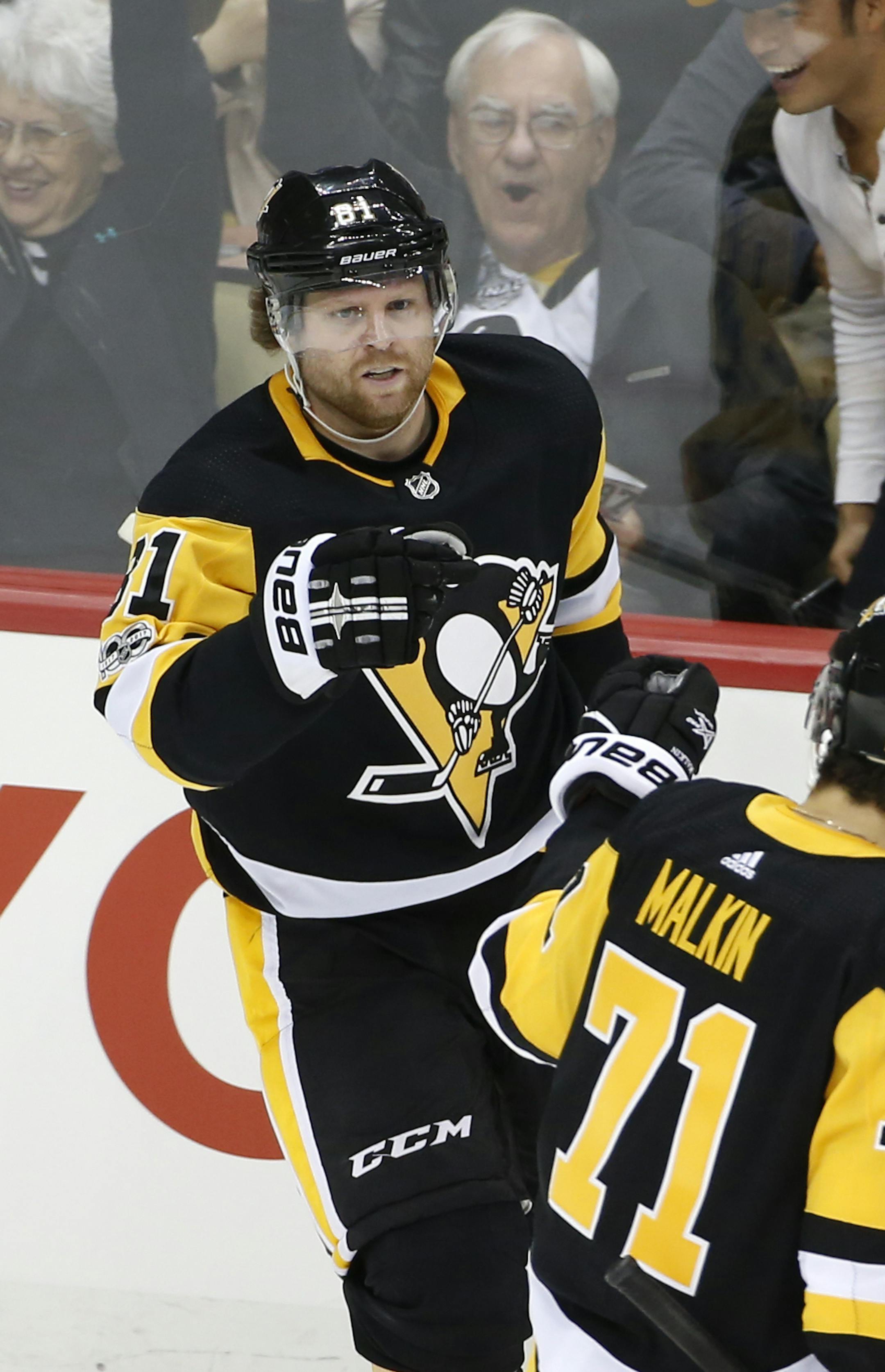 Pittsburgh Penguins' Phil Kessel (81) celebrates his game-winning goal with Evgeni Malkin (71) in the overtime period of an NHL hockey game against the Winnipeg Jets in Pittsburgh, Thursday, Oct. 26, 2017. The Penguins won 2-1. (AP Photo/Gene J. Puskar)